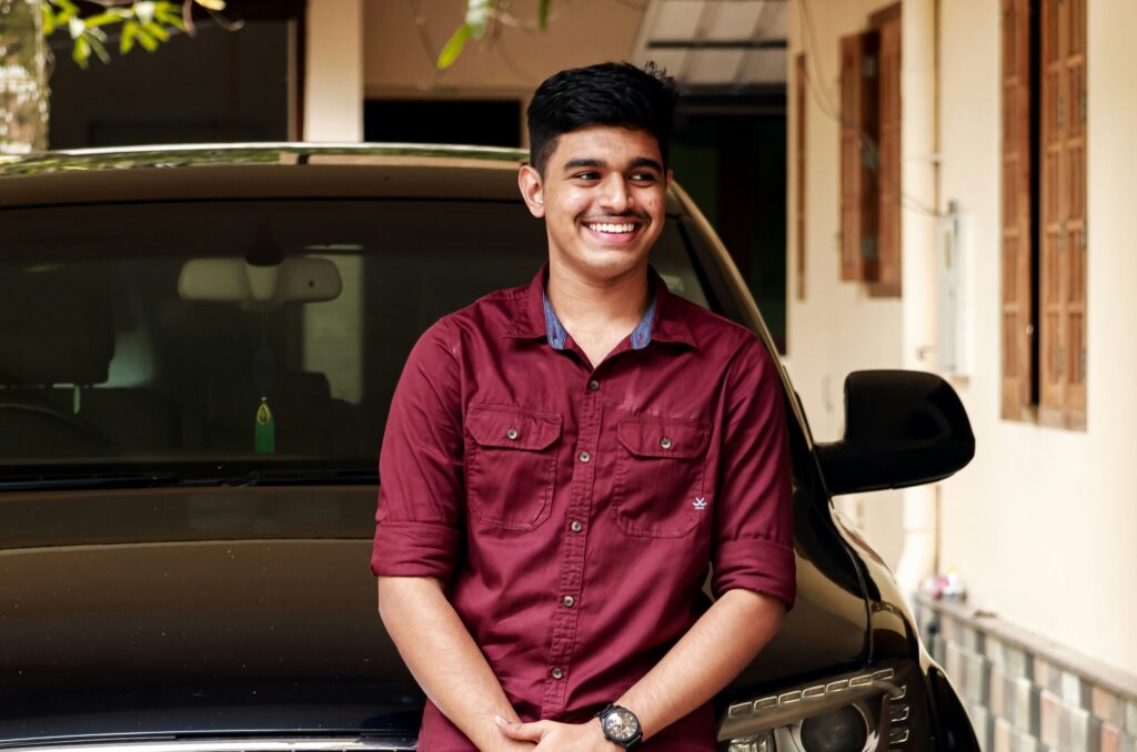 man in a red shirt smiling