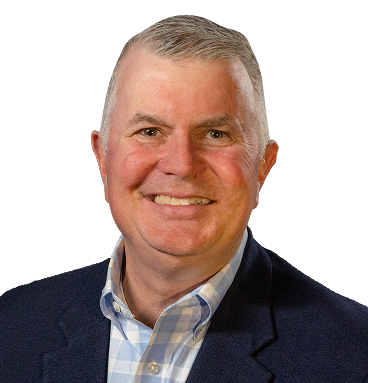A professional headshot of a smiling middle-aged man with short, graying hair, wearing a navy blue blazer over a light blue checkered button-down shirt